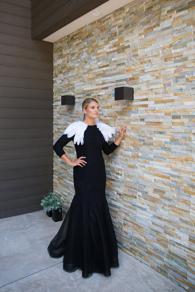 Modest black mermaid gown with white feathered shoulders